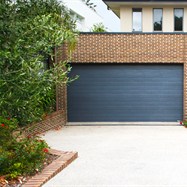  Exposed aggregate driveway, with brick retaining wall to match house.