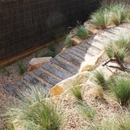 Gravel and sleeper path through dune setting.