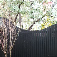  Courtyard off the dining room with feature fence and Frank Lloyd Wright figurine.