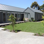   Formal hedging, turf, rose garden, cottage garden with formal pond and screening